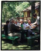 Fly fishing lodge. Chile. The guests at the Cumilahue Fly Fishing Lodge during the summer enjoy the surrounding park and share the fishing experiences at lunch time.  